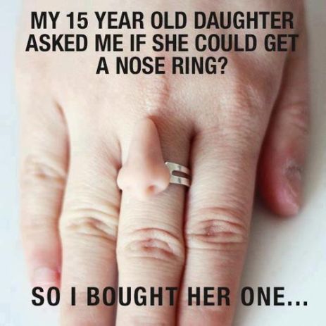 The caption says that the person's daughter asked for nose ring, and the person got her one, but the picture shows a hand with a ring on it that has the shape of a nose on it.