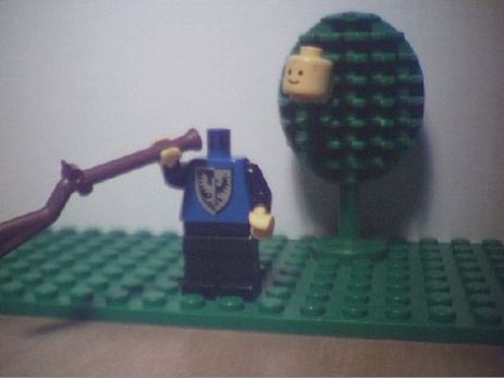 A lego man shot his head off, and it is stuck to a nearby lego tree.